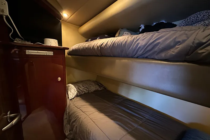 Slide: The Image of Interior cabin of 2007 Sea Ray 60 Sundancer with cozy bunk beds. - 38