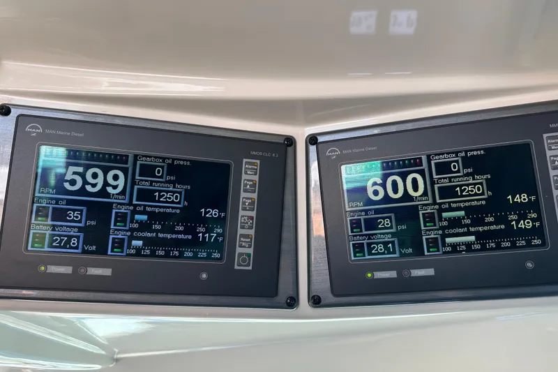 Slide: The Image of Digital control panels on a 2007 Sea Ray 60 Sundancer yacht displaying engine metrics. - 44