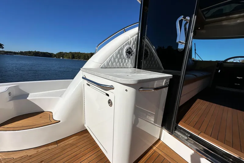 Slide: The Image of 2007 Sea Ray 60 Sundancer yacht with teak deck and sleek interior design. - 9