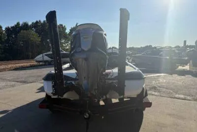 Slide: The Image of 2024 Skeeter FXR21 FLEX boat, rear view, parked outdoors in sunlight. - 2