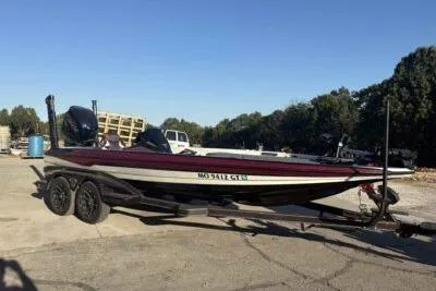 Slide: The Image of 2024 Skeeter FXR21 FLEX boat on trailer in outdoor setting. - 5