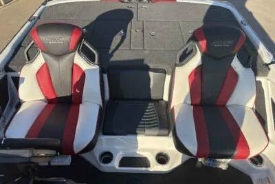 Slide: The Image of 2024 Skeeter FXR21 FLEX boat seats, red and black design, spacious and comfortable layout. - 6