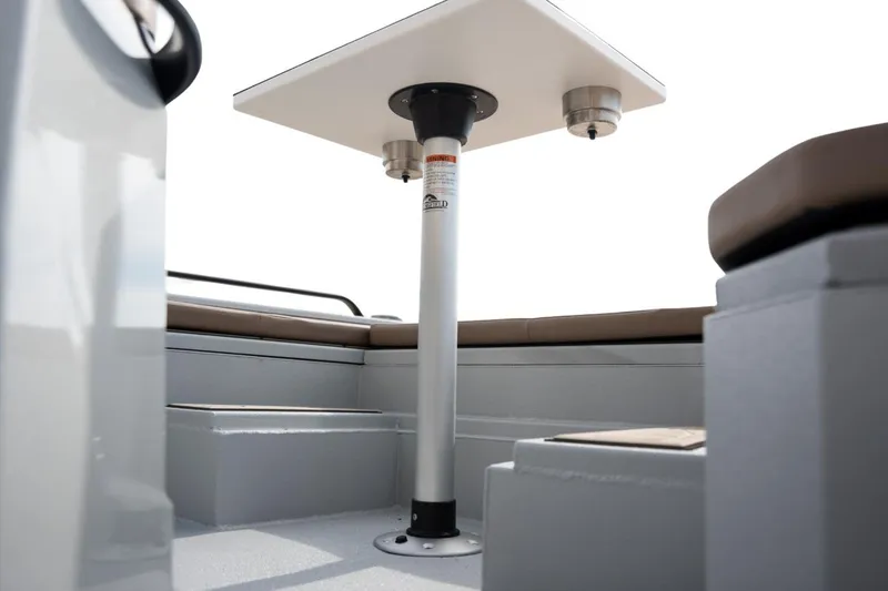 Slide: The Image of Interior view of 2026 Avid 23 Fusion boat with seating and table. - 12