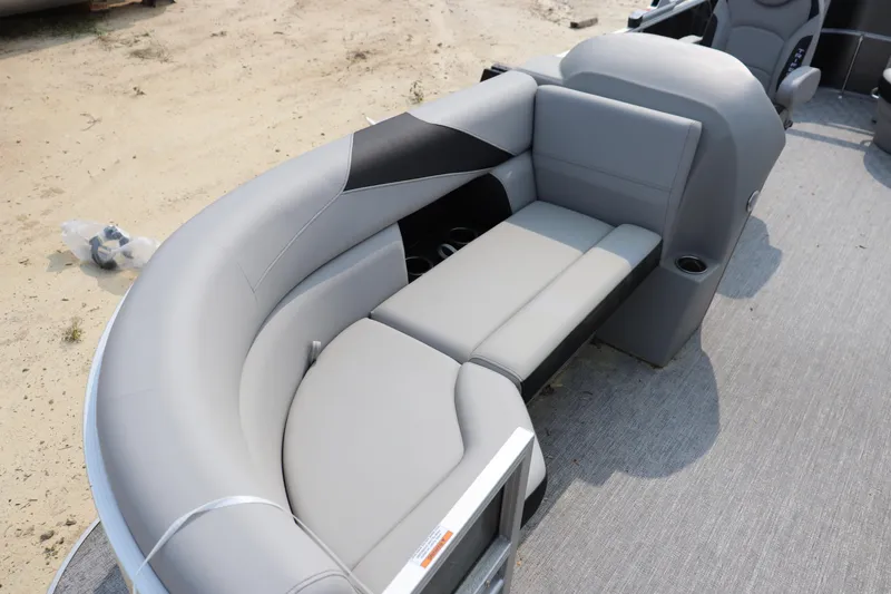Slide: The Image of 2025 Trifecta 22 C LE boat interior with gray seating and cup holders. - 2