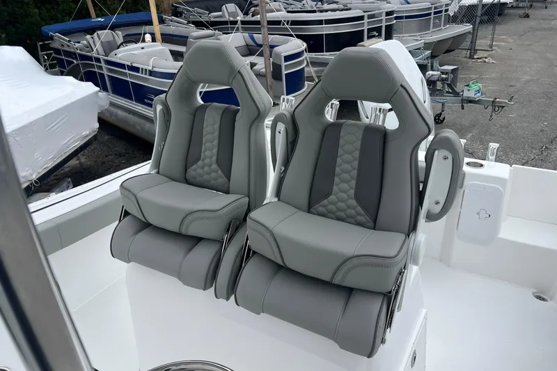 Slide: The Image of Luxury seating on 2026 Cape Horn 22 OS boat, featuring sleek gray upholstery. - 4