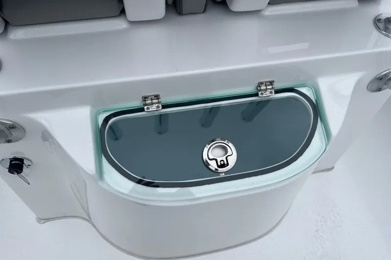 Slide: The Image of 2026 Cape Horn 22 OS boat livewell with secure latch and sleek design. - 5