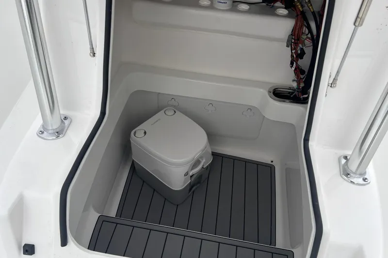 Slide: The Image of 2026 Cape Horn 22 OS boat interior with portable toilet and wiring. - 7