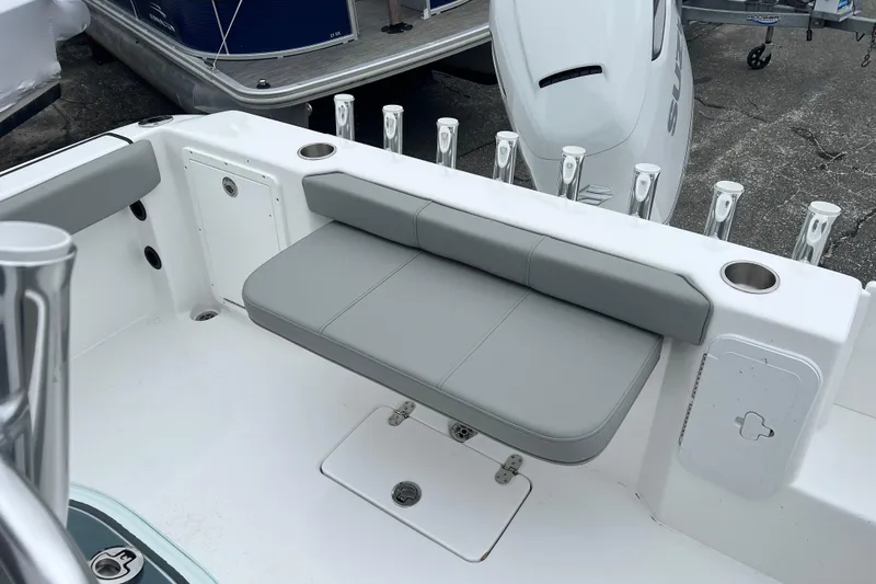 Slide: The Image of Cape Horn 22 OS 2026 boat interior with gray seating and rod holders. - 9