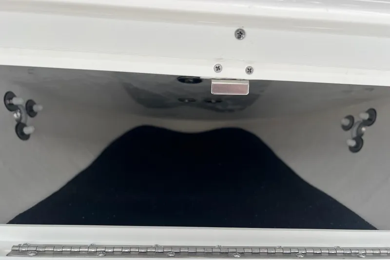 Slide: The Image of 2026 Cape Horn 22 OS storage compartment interior with secure latch and fittings. - 18