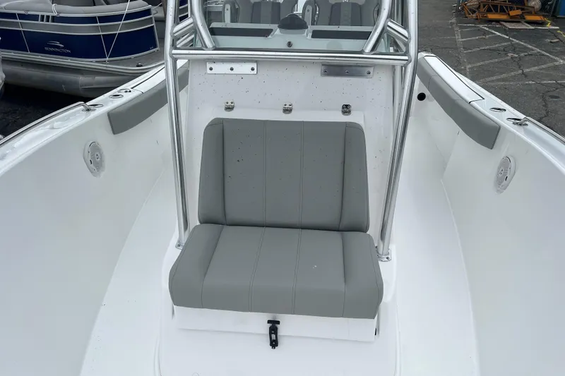 Slide: The Image of 2026 Cape Horn 22 OS boat interior with gray seating and stainless steel frame. - 6