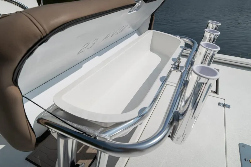 Slide: The Image of Avid 19 FSX 2026 boat seat with gray upholstery and logo detail. - 11