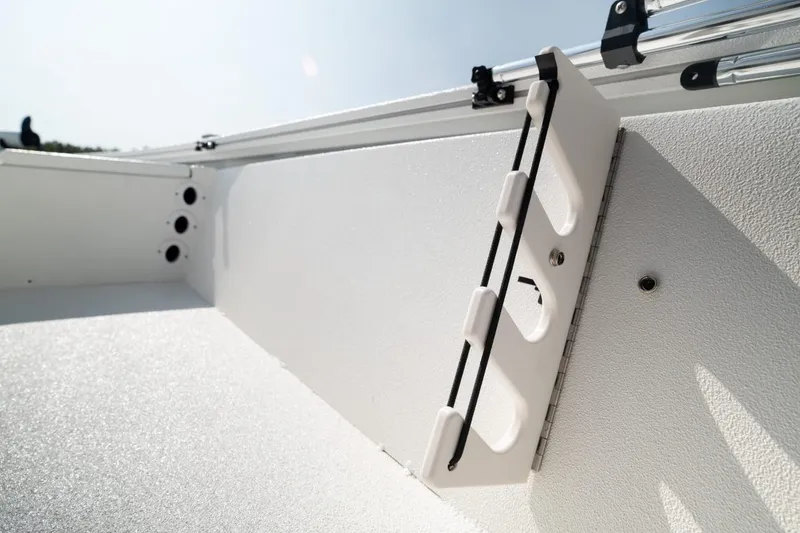 Slide: The Image of Avid 19 FSX 2026 boat seat with logo, featuring rod holders. - 14