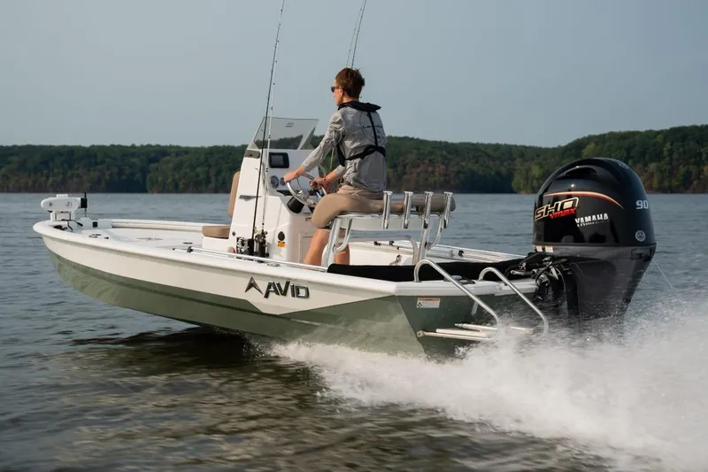 Slide: The Image of Avid 19 FSX 2026 boat seat with storage and rod holders. - 17