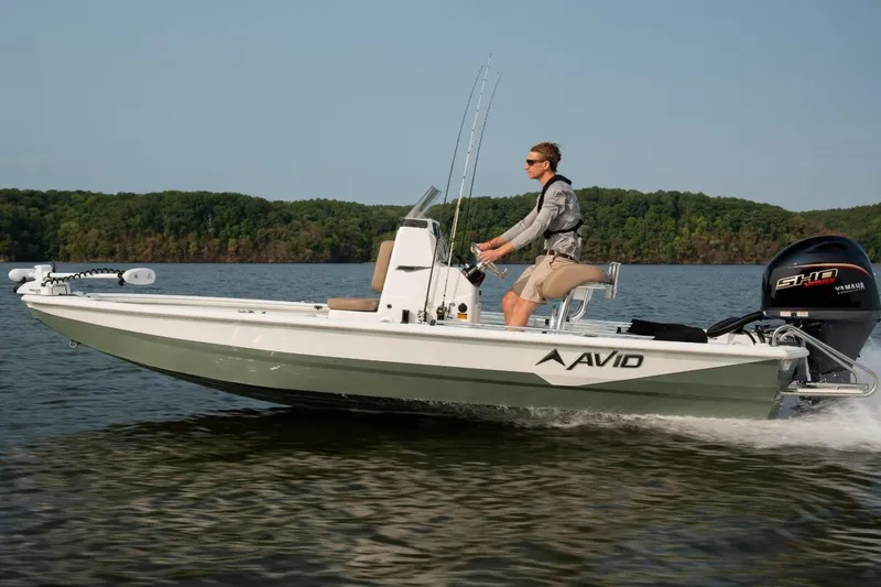 Slide: The Image of Avid 19 FSX 2026 boat deck with branded non-slip mat. - 18