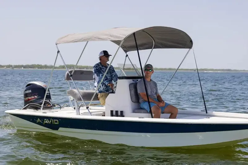 Slide: The Image of Control panel of 2026 Avid 19 FSX boat with steering wheel and gauges. - 20