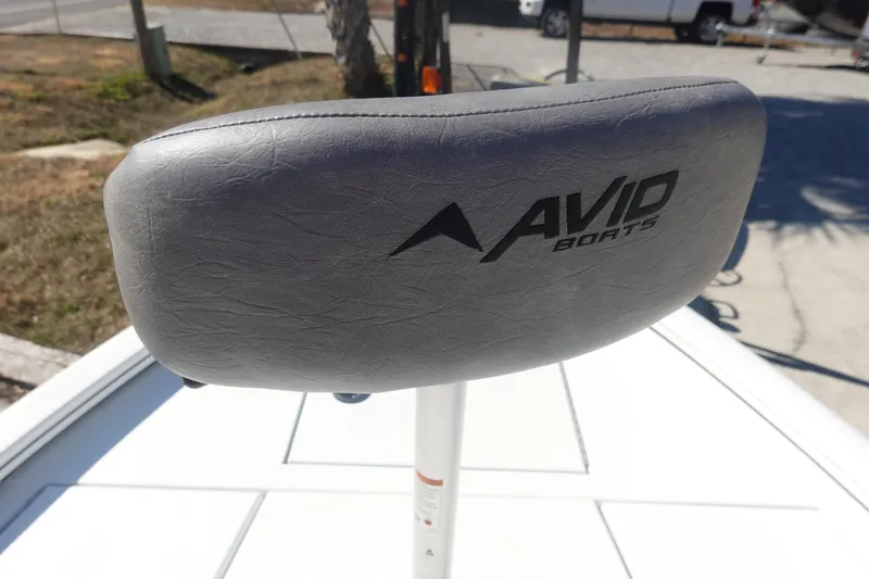 Slide: The Image of Avid 19 FSX 2026 boat seat with logo, outdoor setting. - 29