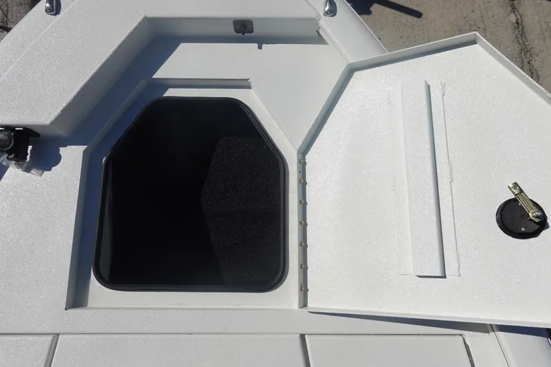 Slide: The Image of Open storage compartment on 2026 Avid 19 FSX boat deck. - 30