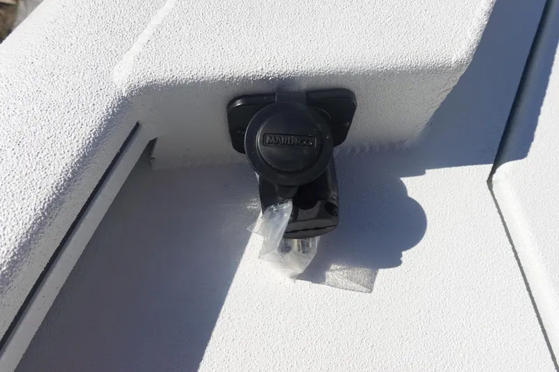 Slide: The Image of Close-up of a 2026 Avid 19 FSX boat's Minn Kota trolling motor plug. - 31