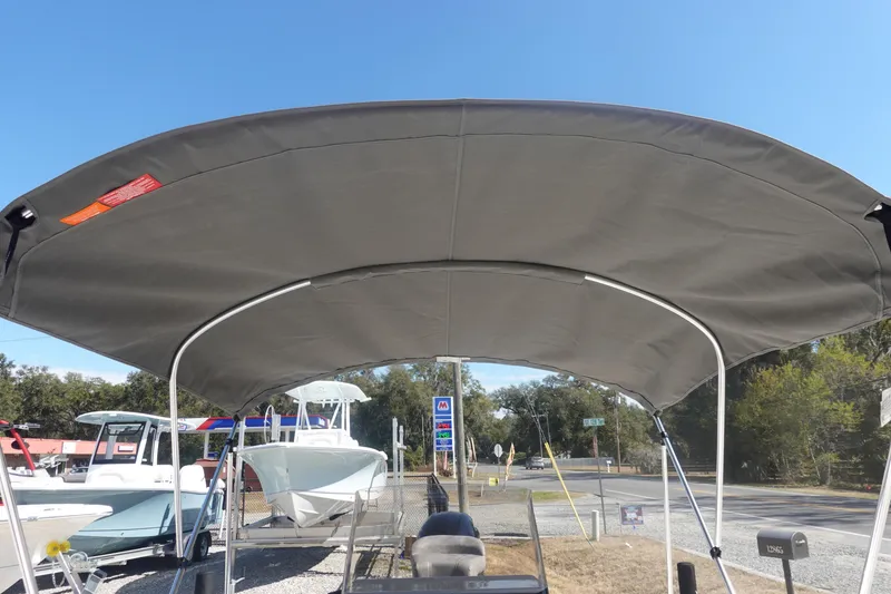 Slide: The Image of 2026 Avid 19 FSX boat with a large canopy, displayed outdoors. - 34