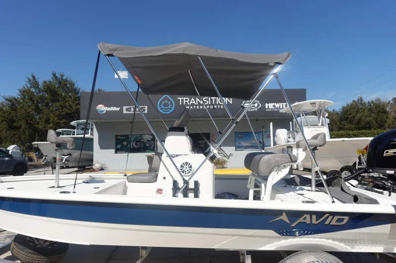 Slide: The Image of 2026 Avid 19 FSX boat with canopy at Transition Watersports dealership. - 35