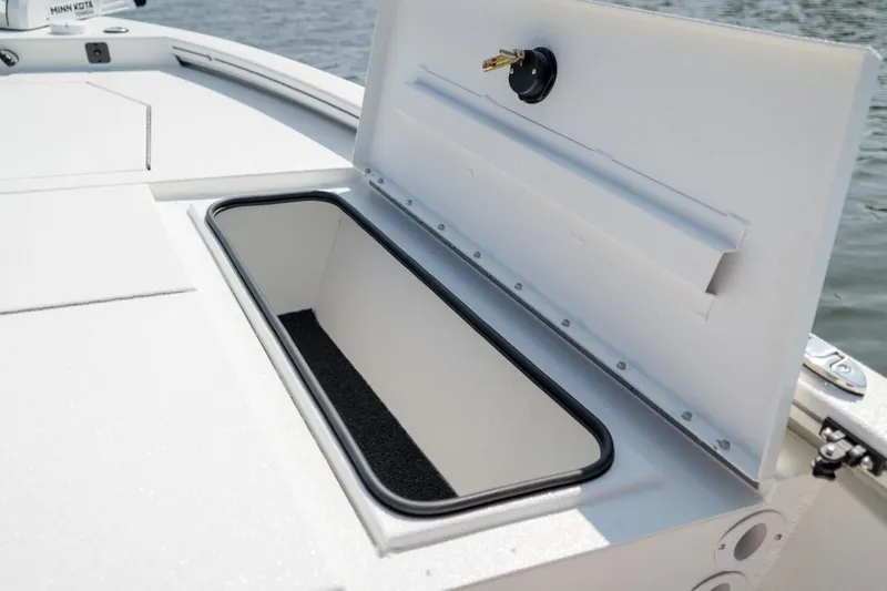 Slide: The Image of 2026 Avid 19 FSX boat on trailer, parked outdoors under clear sky. - 4