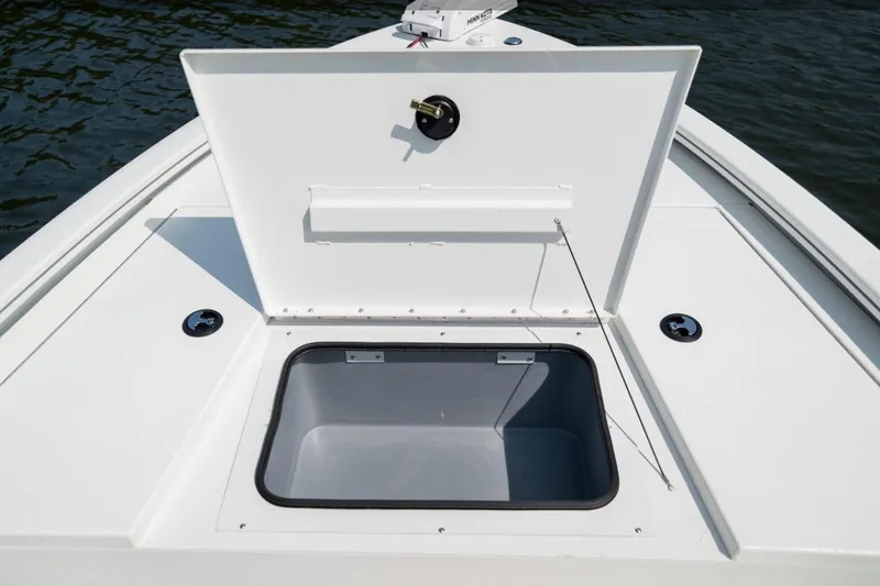 Slide: The Image of 2026 Avid 19 FSX boat on trailer, parked outdoors, side view. - 5