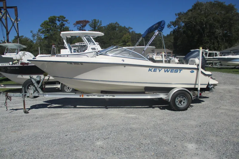 The Image of 2006 Key West 186 Dual Console boat on trailer in outdoor setting. - 0