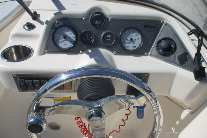 Slide: The Image of Steering console of 2006 Key West 186 Dual Console boat with gauges and controls. - 10