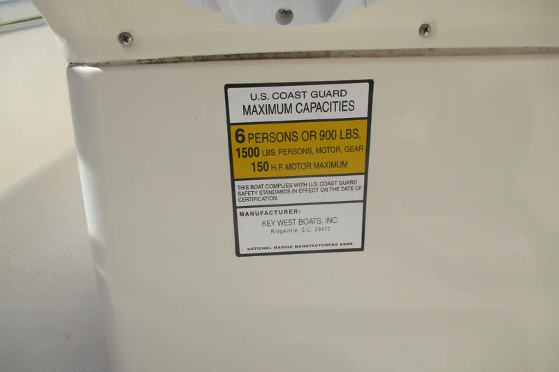 Slide: The Image of Capacity label on 2006 Key West 186 Dual Console boat, 6 persons or 900 lbs. - 12