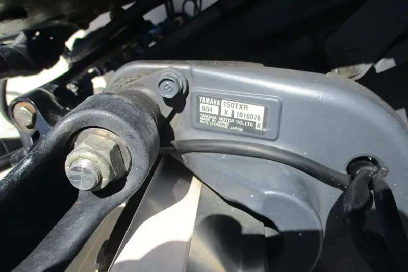 Slide: The Image of Close-up of Yamaha 150TXR engine part on 2006 Key West 186 Dual Console boat. - 13