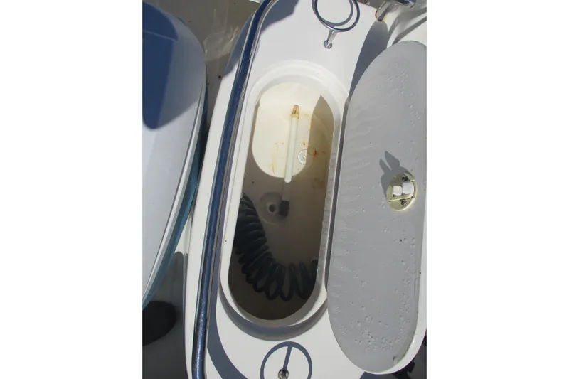 Slide: The Image of Open storage compartment on 2006 Key West 186 Dual Console boat. - 9