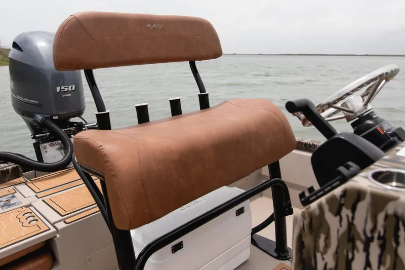 Slide: The Image of Avid 21 Fusion 2026 boat interior with brown leather seat and Yamaha outboard motor. - 10