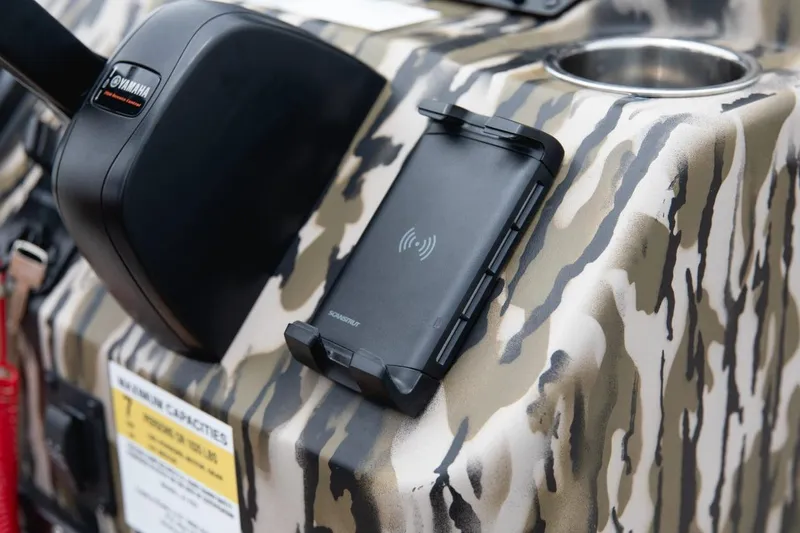 Slide: The Image of Camouflage dashboard of 2026 Avid 21 Fusion boat with wireless phone charger. - 12