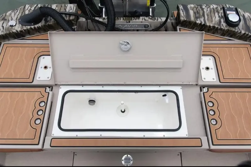 Slide: The Image of Avid 21 Fusion 2026 boat deck with storage compartments and livewell. - 4
