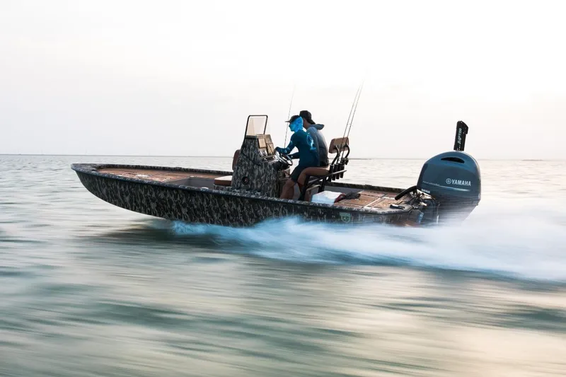 Slide: The Image of Avid 21 Fusion boat speeding on water, 2026 model, with Yamaha engine. - 5