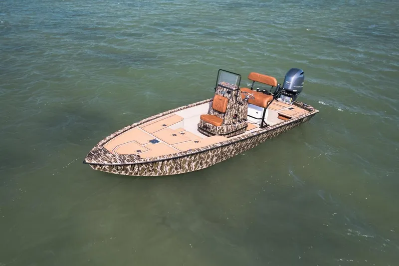 Slide: The Image of Avid 21 Fusion 2026 boat with camouflage design on calm water. - 7