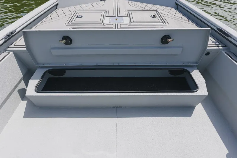 Slide: The Image of 2026 Avid 20 Rogue CC boat interior with tan seat and storage compartment. - 11