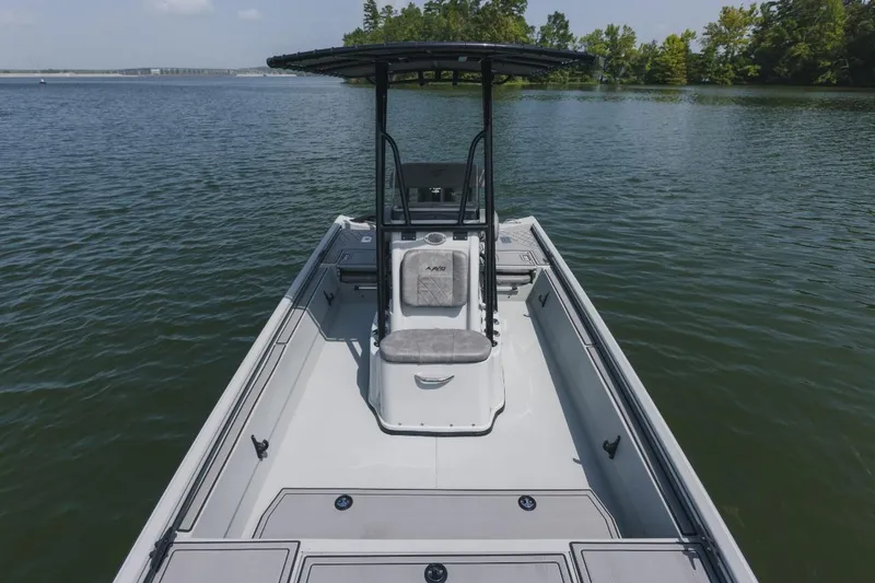 Slide: The Image of Storage compartment in 2026 Avid 20 Rogue CC boat with leather seat and wood finish. - 12