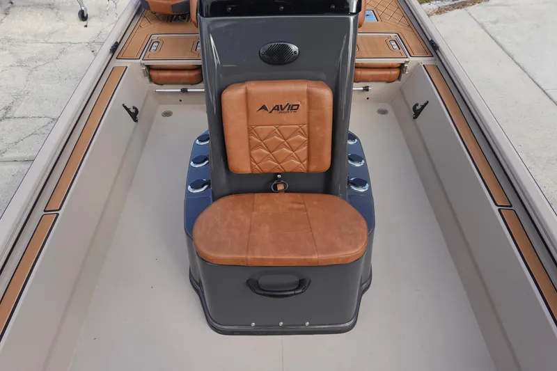 Slide: The Image of 2026 Avid 20 Rogue CC boat interior with brown leather seating and sleek design. - 20