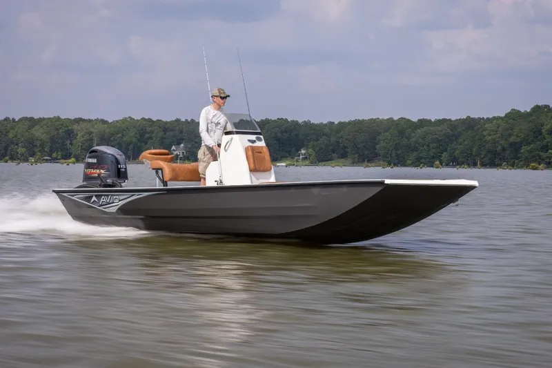 Slide: The Image of Avid 20 Rogue CC 2026 boat on trailer, featuring Yamaha engine, parked outdoors. - 5