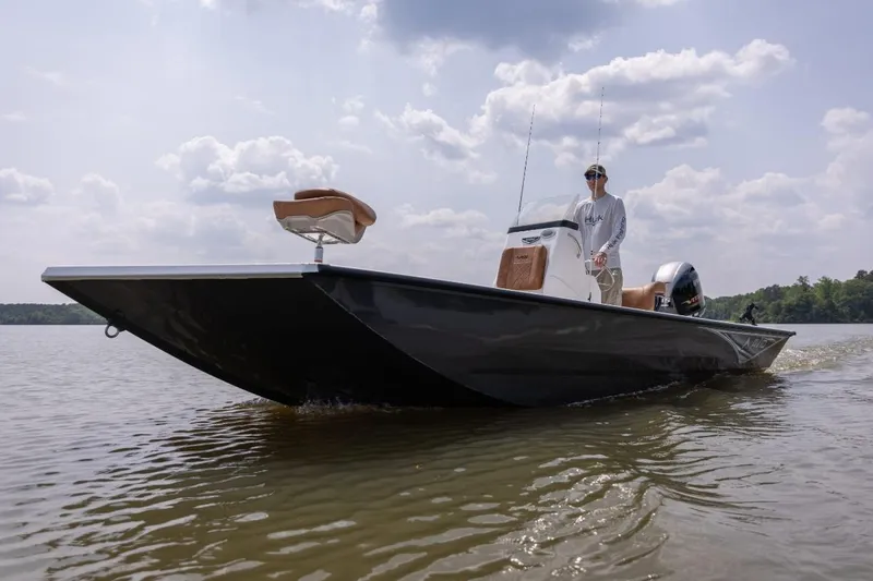 Slide: The Image of 2026 Avid 20 Rogue CC boat with brown seating and sleek design. - 6