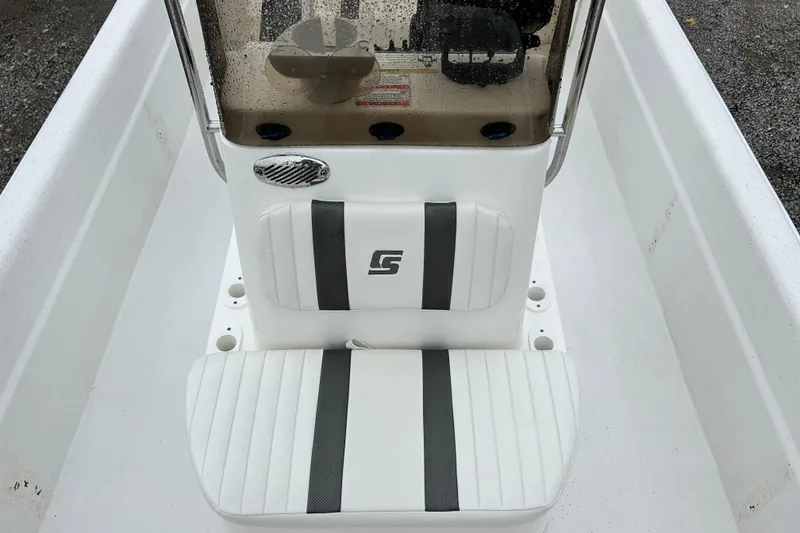 Slide: The Image of 2011 Carolina Skiff JVX18CC boat interior with white seating and console. - 10