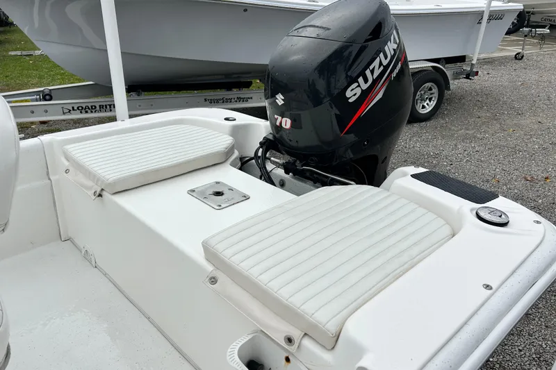 Slide: The Image of 2011 Carolina Skiff JVX18CC boat with Suzuki 70 outboard motor, white seating. - 12