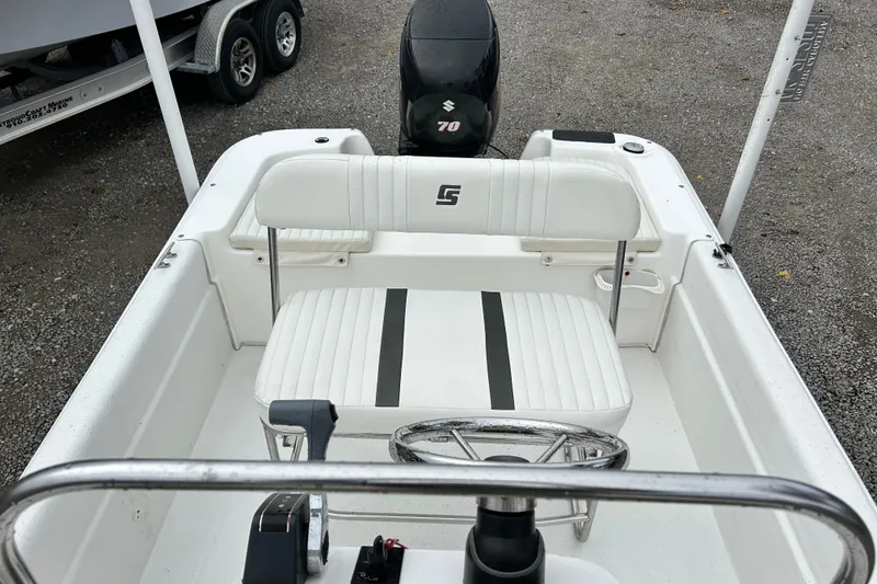 Slide: The Image of 2011 Carolina Skiff JVX18CC boat interior with steering wheel and seating. - 17