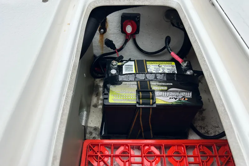 Slide: The Image of Battery compartment of a 2011 Carolina Skiff JVX18CC boat. - 22