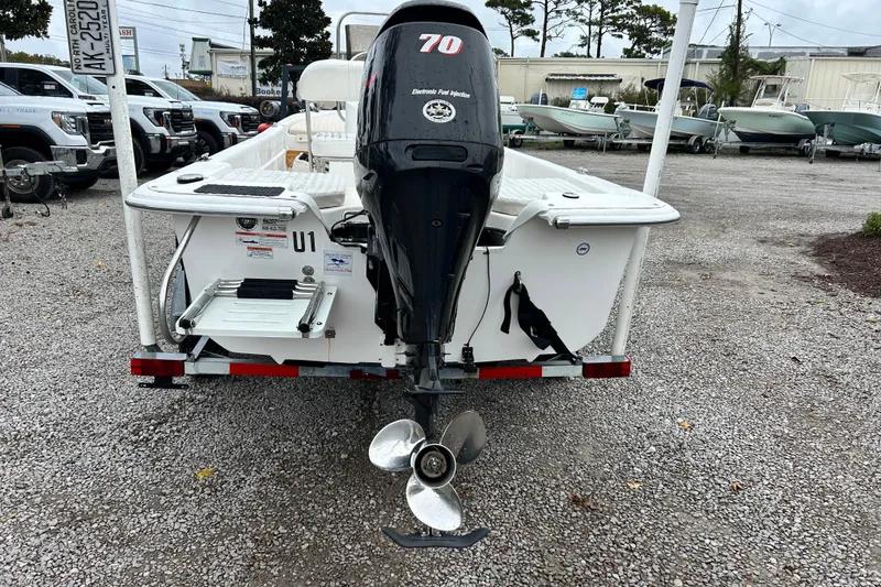 Slide: The Image of 2011 Carolina Skiff JVX18CC boat with outboard motor on trailer. - 3