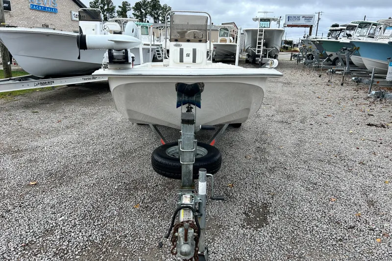 Slide: The Image of 2011 Carolina Skiff JVX18CC boat on trailer in a gravel lot. - 7