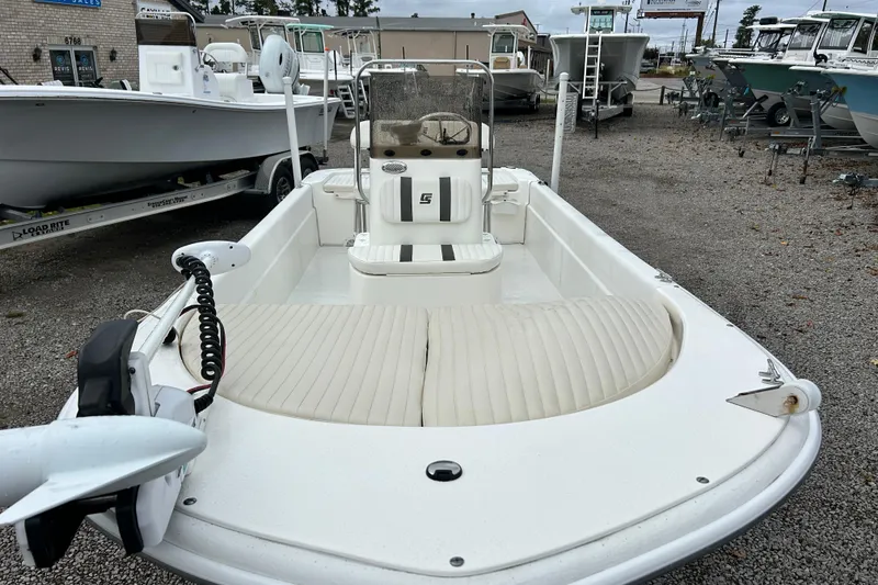 Slide: The Image of 2011 Carolina Skiff JVX18CC boat on display at a dealership lot. - 8