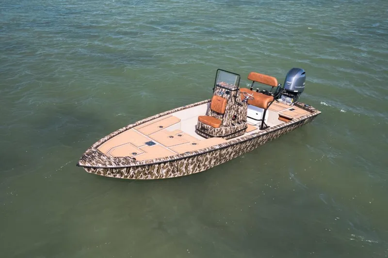 Slide: The Image of 2026 Avid 21 FST boat with camouflage design on open water. - 6