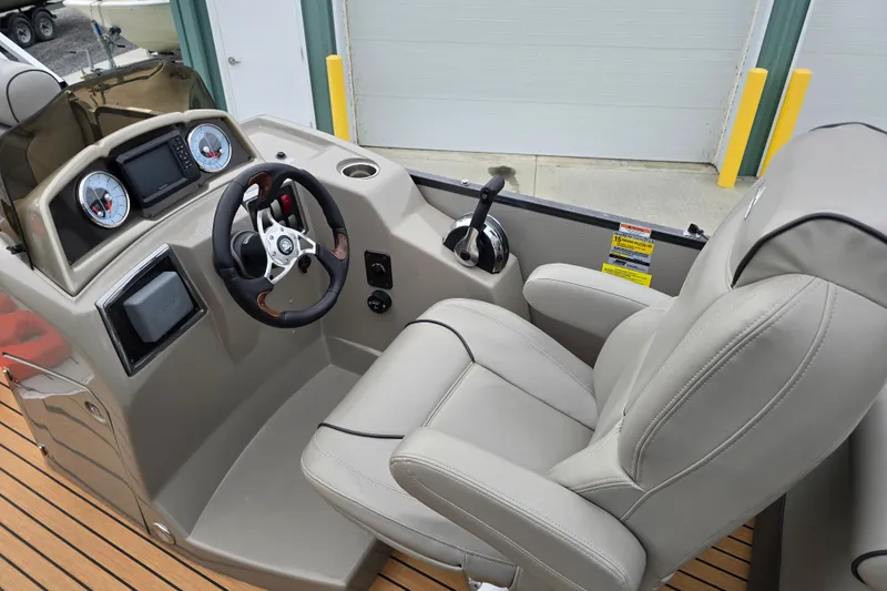 Slide: The Image of 2015 Premier 230 SunSation RF pontoon boat bow detail with metal and wood accents. - 12